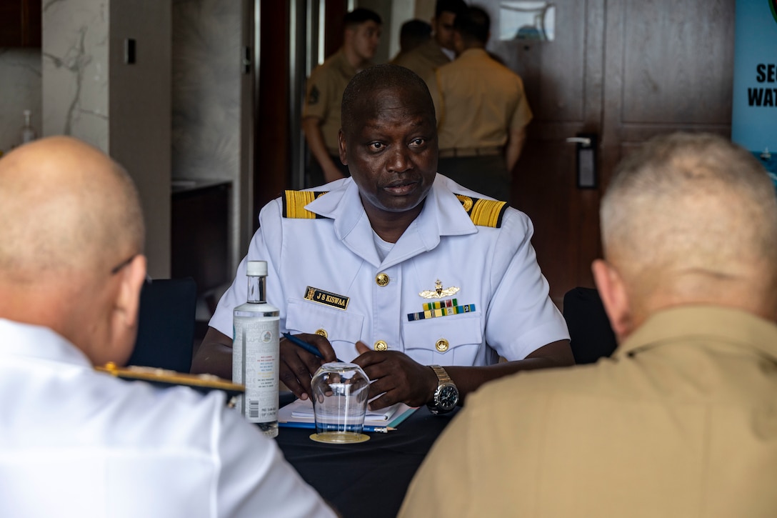 U.S. Navy Rear Adm. Michael S. Mattis, commander, Command Task Force 66, left, Kenya Navy Brig. Gen. John Sankale Kiswaa, deputy commander of the Kenya Navy, center, and U.S. Marine Corps Maj. Gen. Robert B. Sofge Jr., commander, U.S. Marine Corps Forces Europe and Africa, right, attend a bilateral engagement in Pointe aux Piments, Mauritius, June 26, 2025. African Maritime Forces Summit is a summit that seeks to bring together senior leaders from African maritime forces, naval infantries, and militaries, alongside international partners, to address critical maritime security challenges facing the African continent. (U.S. Marine Corps photo by Sgt. Addysyn Tobar)