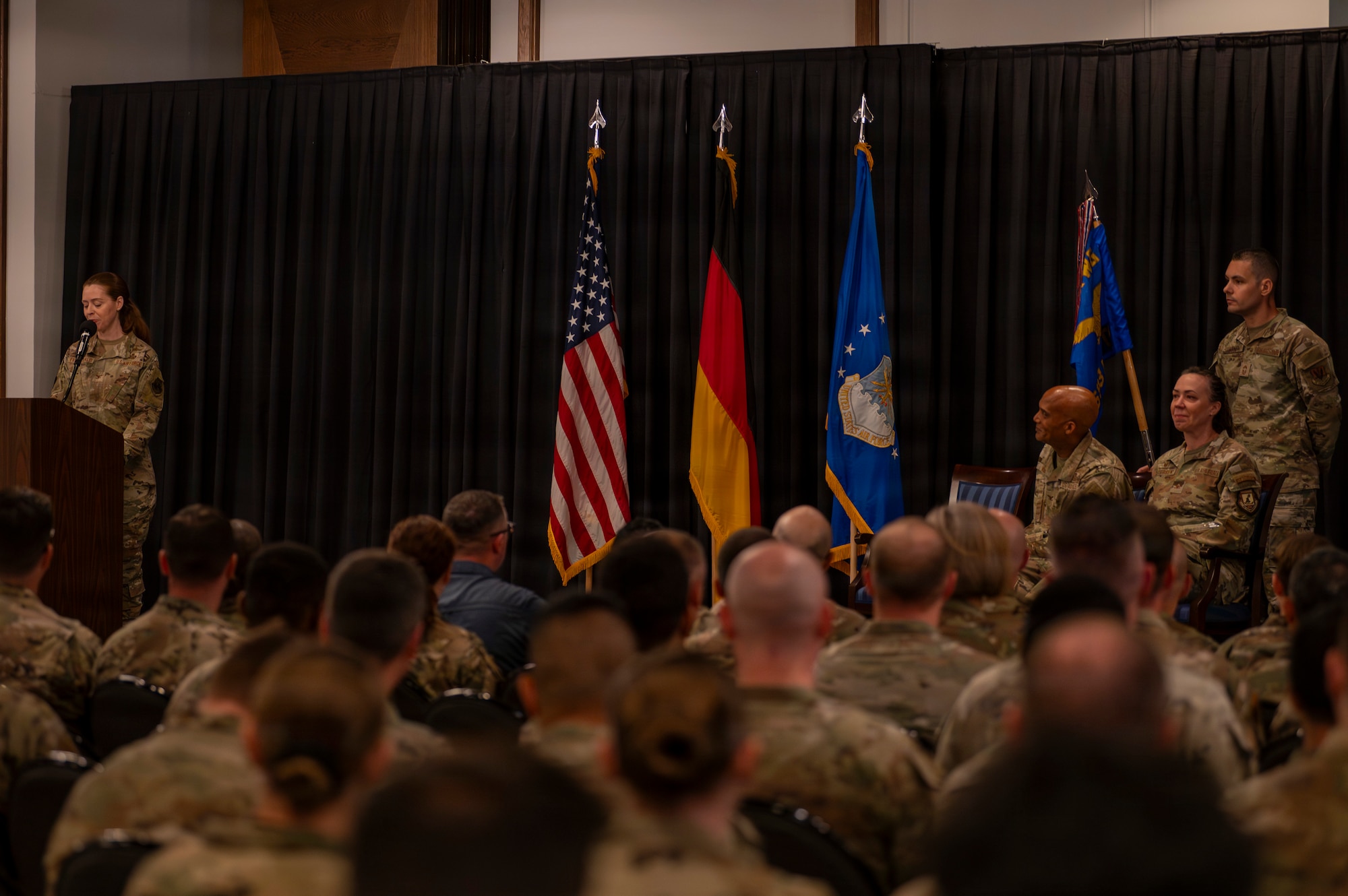 A photo of an Airman giving a speech during a change of command ceremony
