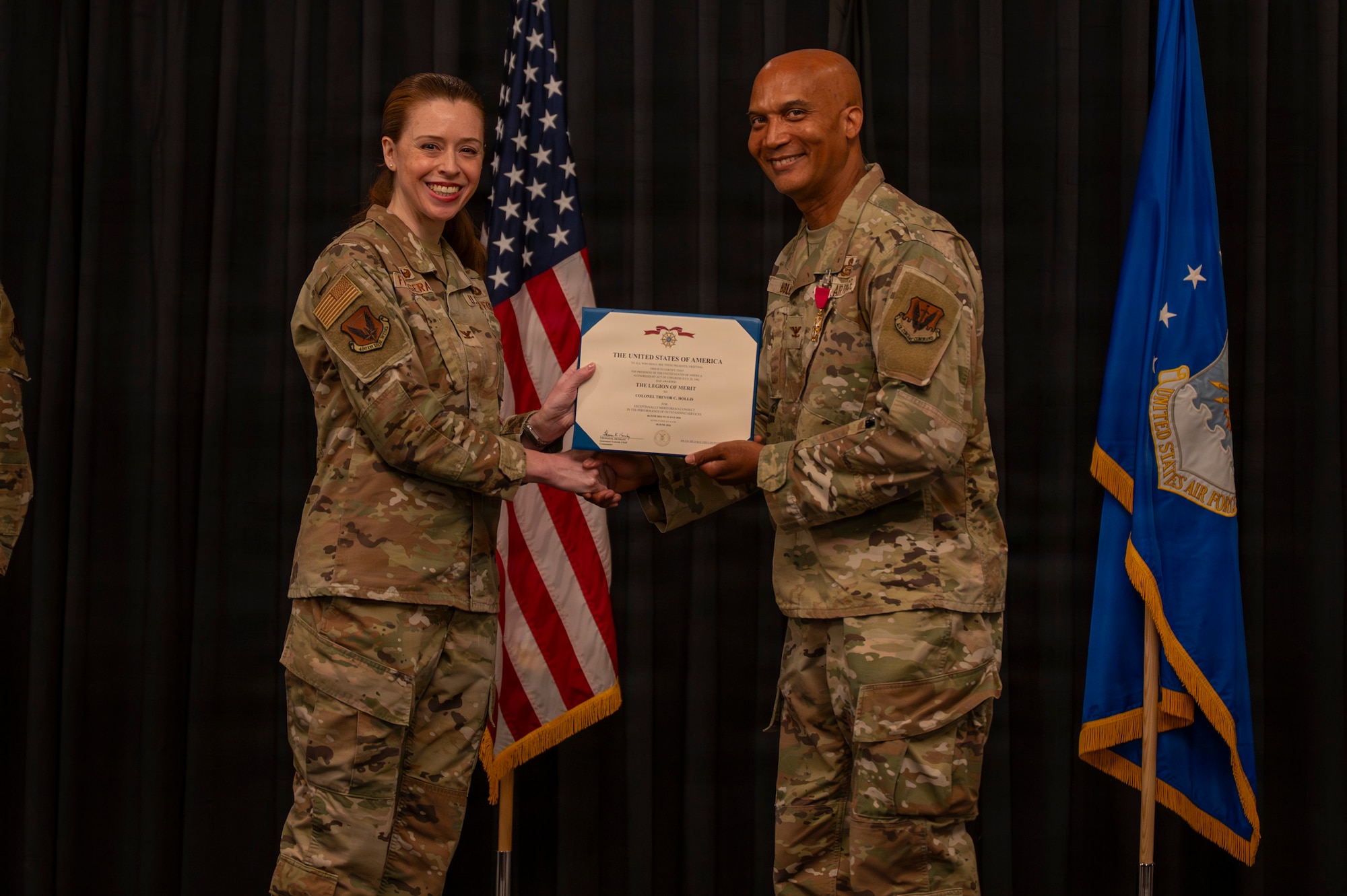 A photo of an Airman receiving an award