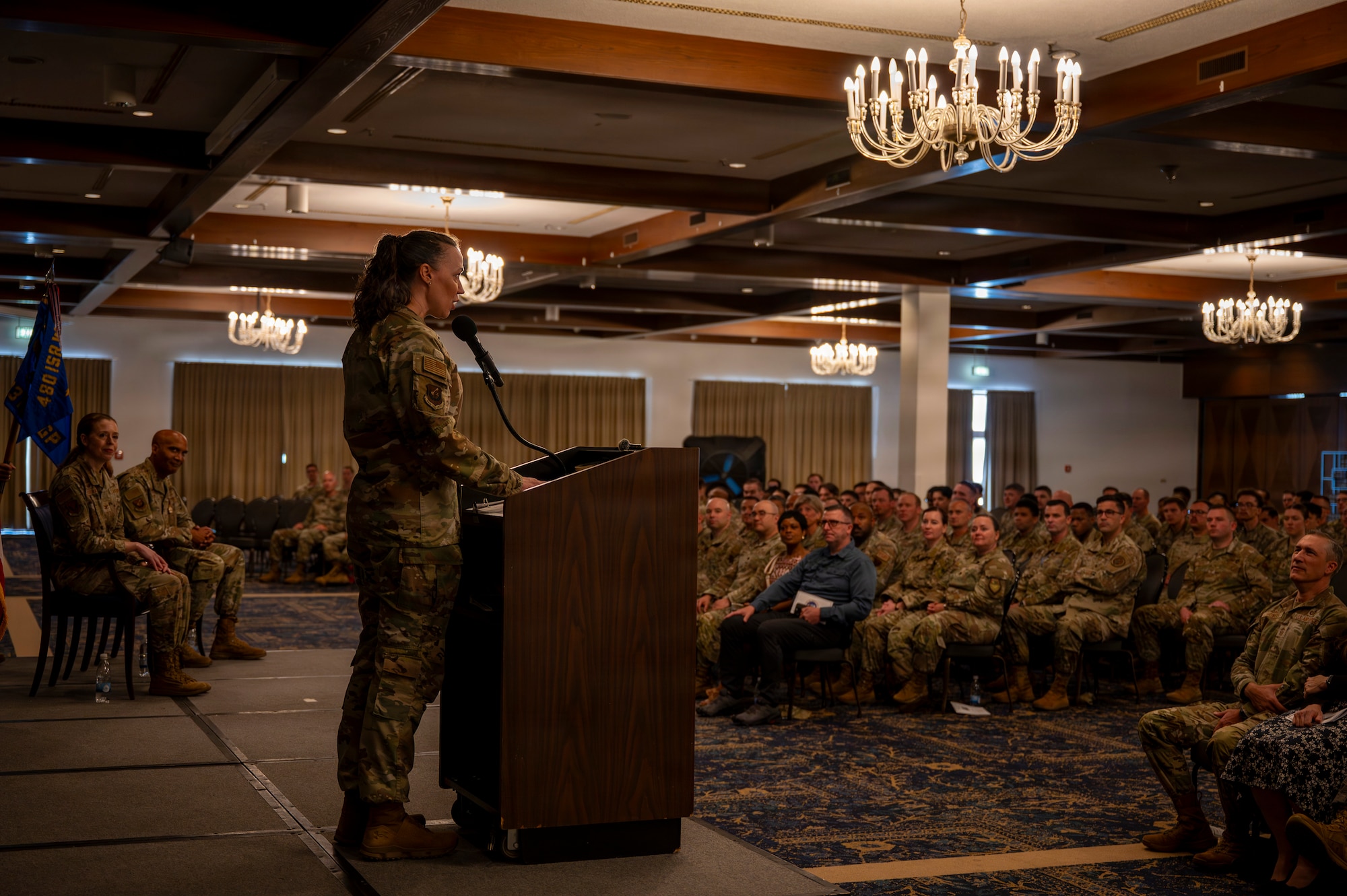 A photo of an Airman giving a speech during a change of command ceremony