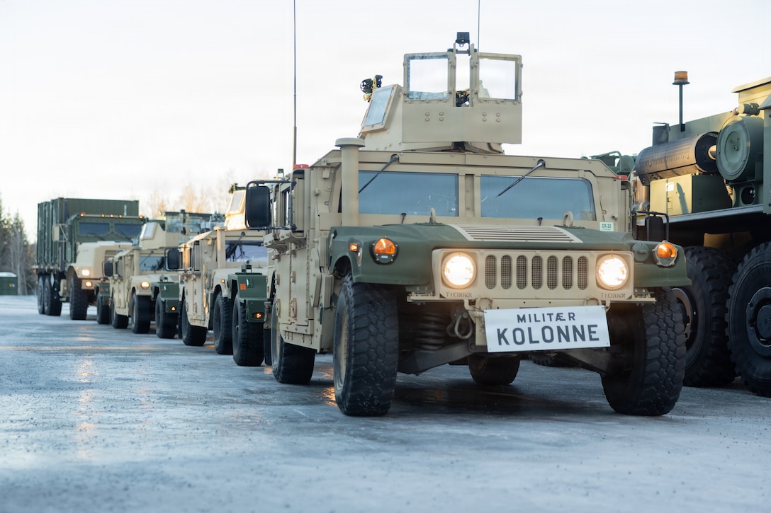 U.S. Marine Corps tactical vehicles with 2nd Distribution Support Battalion, Combat Logistics Regiment 27, 2nd Marine Logistics Group, are staged before a tactical convoy in preparation for exercise Cold Response 26 in Tromsdalen, Norway, Jan. 22, 2026. The Marine Corps Pre-positioning Program-Norway, managed by Blount Island Command, enables the rapid outfitting of a deployed Marine Air-Ground Task Force by storing ready-to-use equipment in climate-controlled caves. Exercise Cold Response 26 is a Norwegian-led winter military exercise designed to enhance collective defense capabilities and ensure U.S. readiness to rapidly deploy and seamlessly operate alongside NATO Allies in challenging arctic conditions. (U.S. Marine Corps photo by Lance Cpl. Franco Lewis)