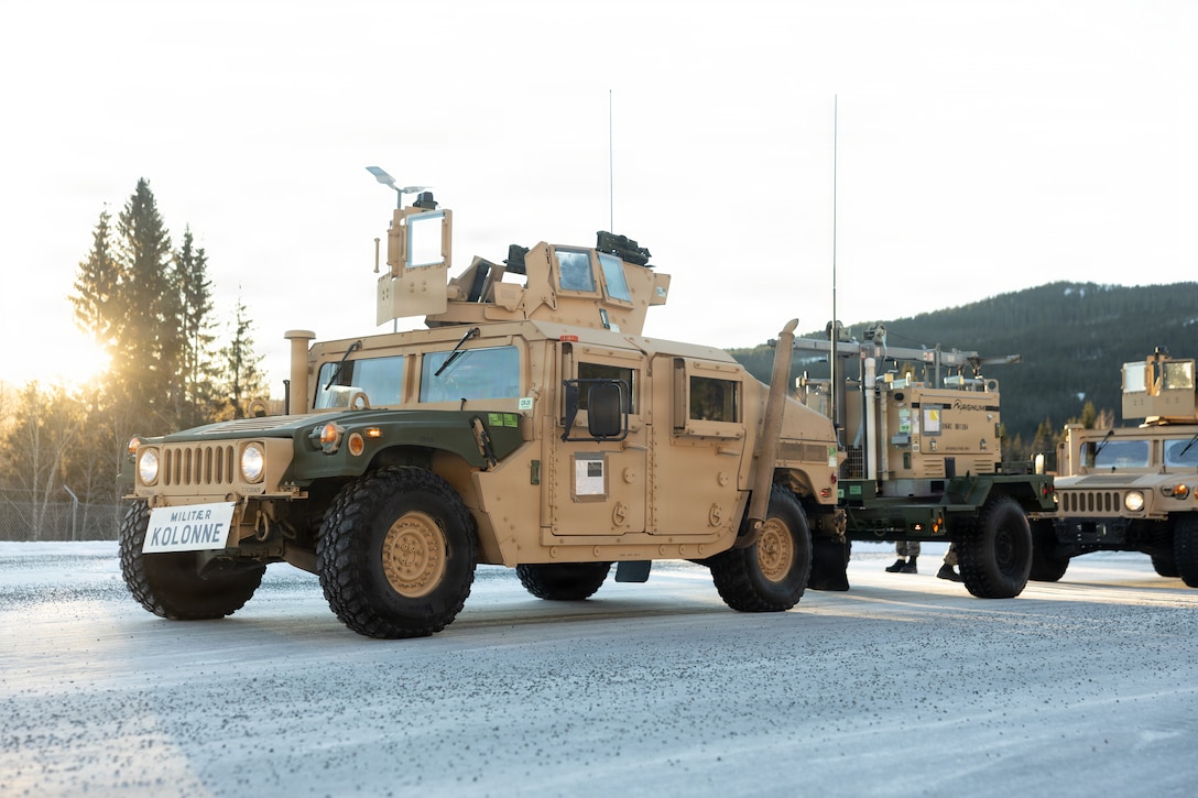 U.S. Marine Corps tactical vehicles with 2nd Distribution Support Battalion, Combat Logistics Regiment 27, 2nd Marine Logistics Group, are staged before a tactical convoy in preparation for exercise Cold Response 26 in Tromsdalen, Norway, Jan. 22, 2026. The Marine Corps Pre-positioning Program-Norway, managed by Blount Island Command, enables the rapid outfitting of a deployed Marine Air-Ground Task Force by storing ready-to-use equipment in climate-controlled caves. Exercise Cold Response 26 is a Norwegian-led winter military exercise designed to enhance collective defense capabilities and ensure U.S. readiness to rapidly deploy and seamlessly operate alongside NATO Allies in challenging arctic conditions. (U.S. Marine Corps photo by Lance Cpl. Franco Lewis)