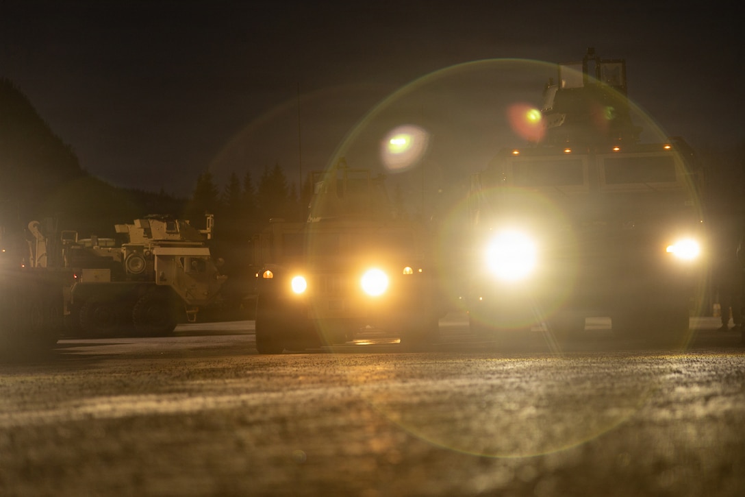 U.S. Marine Corps tactical vehicles assigned to 2nd Distribution Support Battalion, Combat Logistics Regiment 27, 2nd Marine Logistics Group, drawn from caves from the Marine Corps Pre-positioning Program-Norway, are staged for a tactical convoy in preparation for exercise Cold Response 26 in Tromsdalen, Norway, Jan. 22, 2026. Exercise Cold Response 26 is a Norwegian-led winter military exercise designed to enhance collective defense capabilities and ensure U.S. readiness to rapidly deploy and seamlessly operate alongside NATO Allies in challenging arctic conditions. (U.S. Marine Corps photo by Lance Cpl. Franco Lewis)