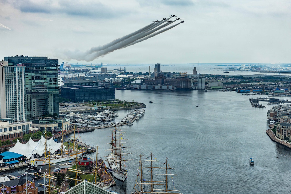 U.S. Navy Flight Demonstration Team, The Blue Angels, execute aerial maneuvers during an air show over Baltimore harbor.