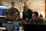 A Chilean air force member explains satellite tracking and space operations at the space cell during Exercise Salitre 2026 at Cerro Moreno Air Base in Antofagasta, Chile, July 9, 2026. Performing space operations between U.S, Chile and other partner nation counterparts helped forge the trust and seamless integration essential for ensuring collective security in the hemisphere. (U.S. Air Force photo by Tech. Sgt. Joshua Edwards)