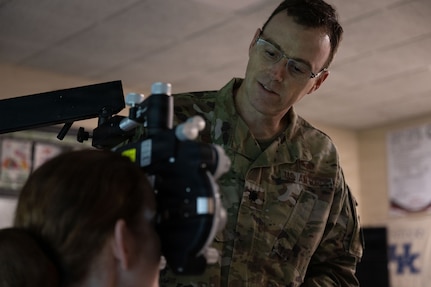U.S. Air Force Lt. Col. John Adams, performs an eye exam during the Green River Area Wellness Innovative Readiness Training, or IRT, mission, June 17, 2026.