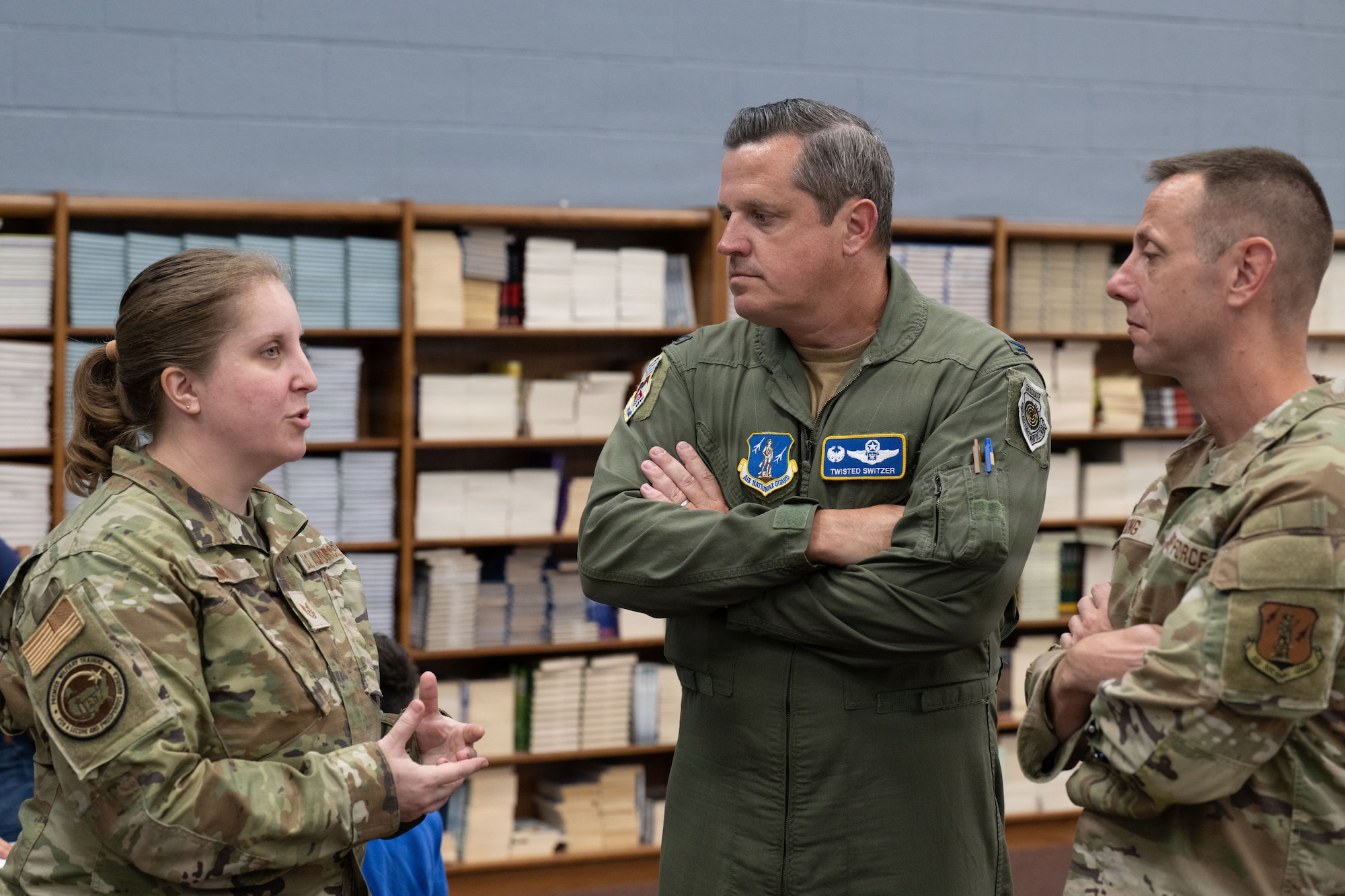 U.S. Air Force Tech. Sgt. Elizabeth King, left, briefs Col. Richard Switzer and CMSgt Jeff King during the Distinguished Visitors Day at the Green River Area Wellness Innovative Readiness Training mission, June 17, 2026