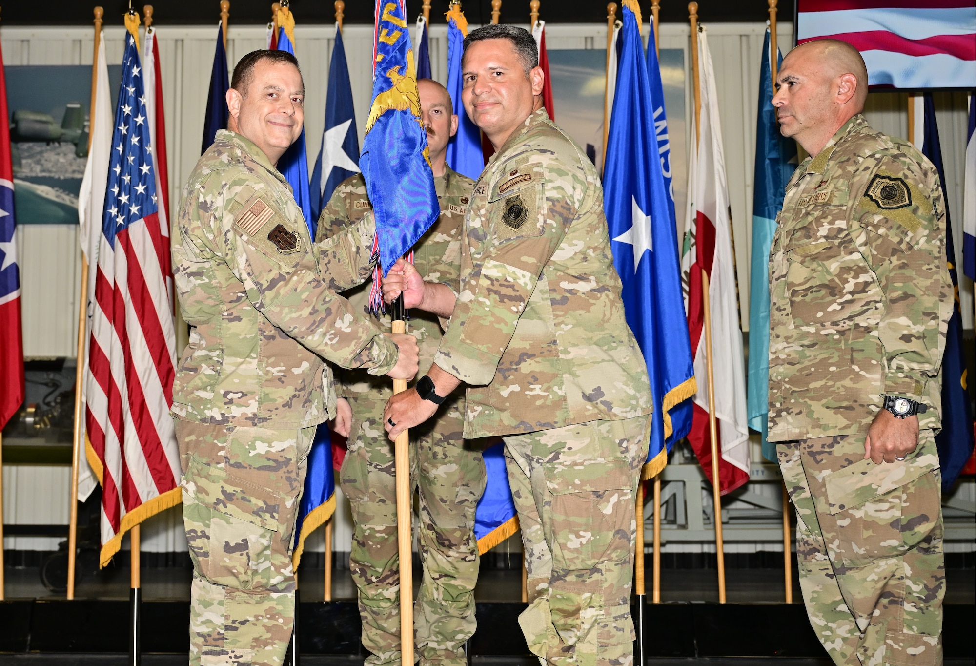 (Middle) Lt. Col. Michael Lopez assumes command of Air Force Operational Test and Evaluation Center Detachment 2 from (left) AFOTEC Commander Brig. Gen. Jesse J. Friedel at Eglin AFB, Fla., on July 9, 2026, as (right) outgoing Detachment 2 commander Col. Kevin M. Madrigal stands by. Lopez is a command pilot with more than 3,000 flight hours, including 611 combat hours.