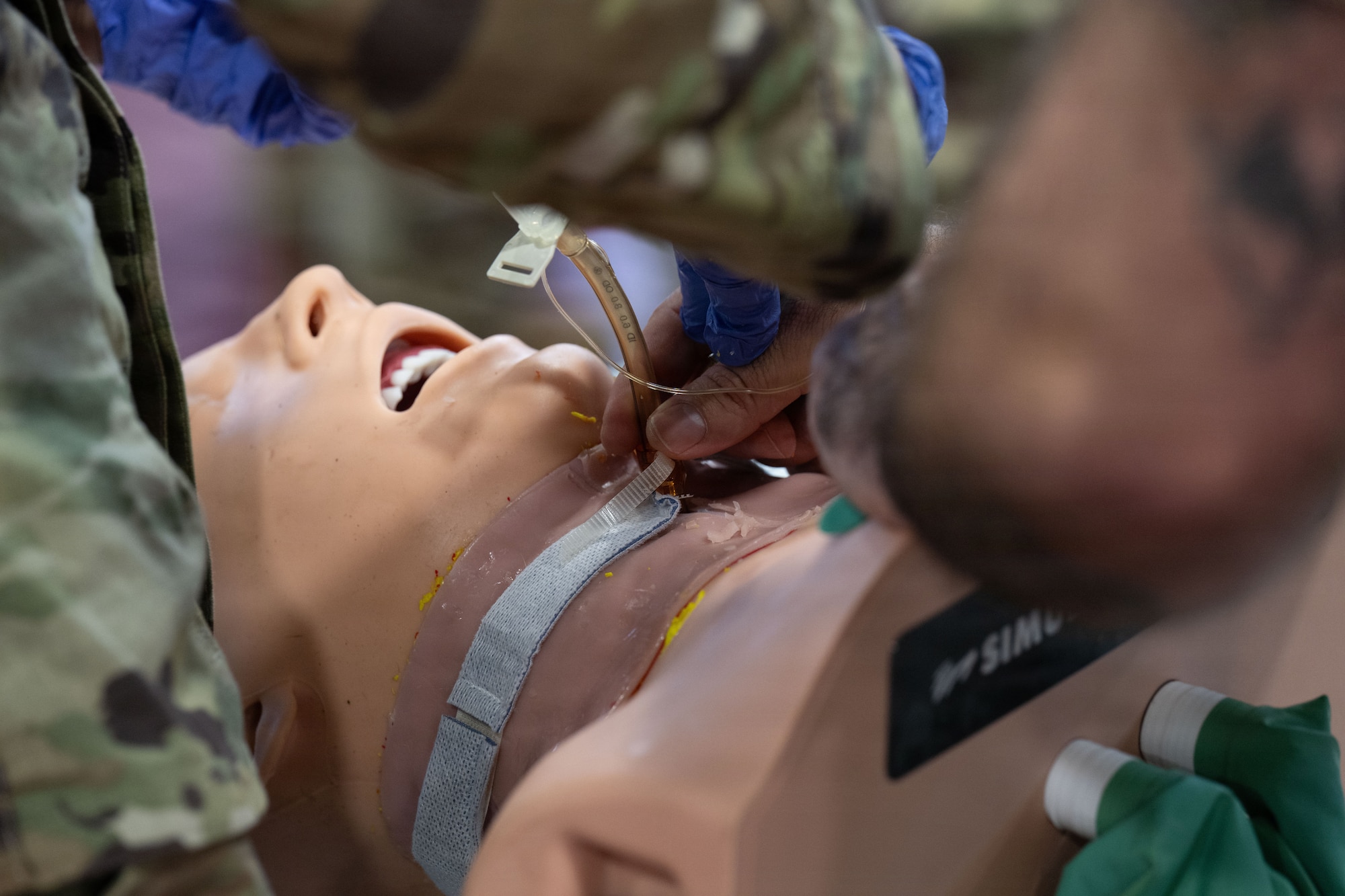 U.S. Air Force SrA Tamara Painter, finishes performing a tracheostomy at the Green River Area Wellness Innovative Readiness Training mission