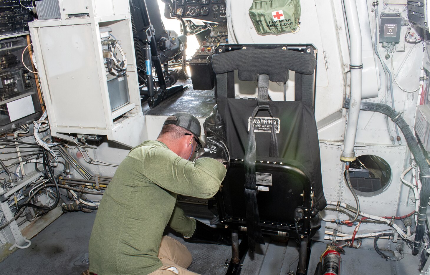 A Fleet Readiness Center East (FRCE) aircraft maintainer for the H-53 production line performs maintenance on an MH-53 Sea Dragon in support of the heavy-lift mission. FRCE recently achieved a 14% reduction in H-53 turnaround time.