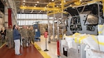Fleet Readiness Center East (FRCE) Planning and Operations Division Director Michael Wagoner stops at a CH-53K King Stallion undergoing maintenance as he leads a group of Marines from the 2nd Marine Logistics Group (2nd MLG) at Camp Lejeune, N.C., on a tour of the depot’s H-53 aircraft production line Feb. 12.