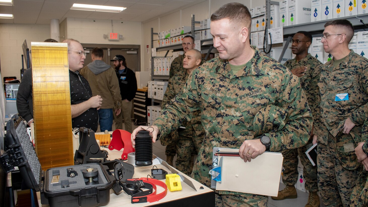 Master Gunnery Sgt. David Smith, a Marine with 2nd Marine Logistics Group (2nd MLG) at Camp Lejeune, N.C., inspects a bellows produced using additive manufacturing (commonly referred to as 3D printing) in the Fleet Readiness Center East (FRCE) Innovation Lab, located at the depot’s facilities onboard Marine Corps Air Station Cherry Point, N.C., Feb.12.