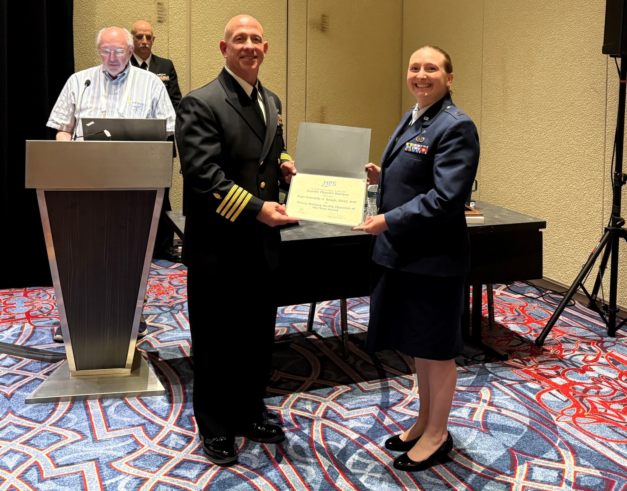 Capt. Gabrielle Baugh accepts the Young Health Physicist of the Year Award
