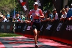 Navy Lt. Cmdr. Kalan Kelly, Oklahoma City MEPS commander, runs towards the finish during an elite race.