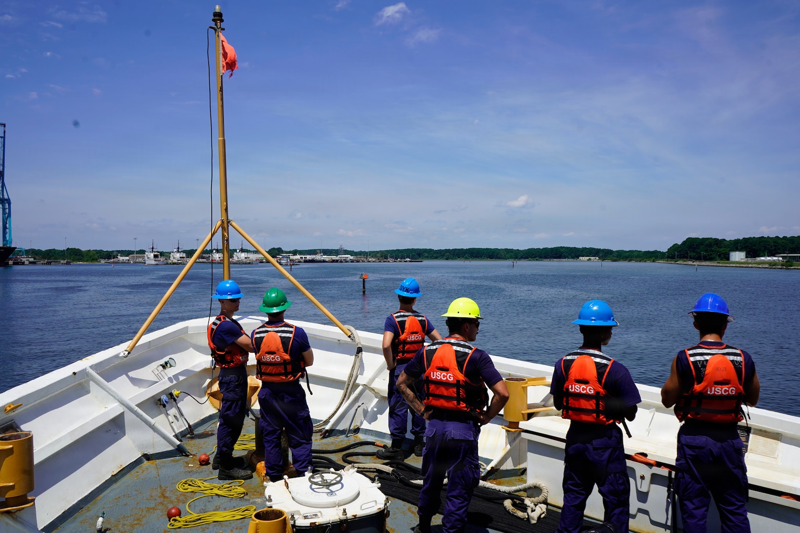 Deck department members assigned to the Reliance-class medium-endurance cutter USCGC Venturous (WMEC 625) stand anchor watch as the cutter arrives at Coast Guard Base Portsmouth, July 10, 2026. The Venturous is one of two 210-foot medium endurance cutters relocating from St. Petersburg, Florida, to Base Portsmouth as part of a strategic home port shift bringing approximately 154 personnel and their families to the Hampton Roads area. (U.S. Coast Guard photo by Seaman Adriel Franqui-Toro)