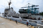 The crew of the Reliance-class medium-endurance cutter USCGC Resolute (WMEC 620) arrives at its new homeport at Coast Guard Base Portsmouth, July 13, 2026. The Resolute is one of two 210-foot medium endurance cutters relocating from St. Petersburg, Florida, to Base Portsmouth as part of a strategic homeport shift bringing approximately 154 personnel and their families to the Hampton Roads area. (U.S. Coast Guard photo by Petty Officer 2nd Class Kate Kilroy)
