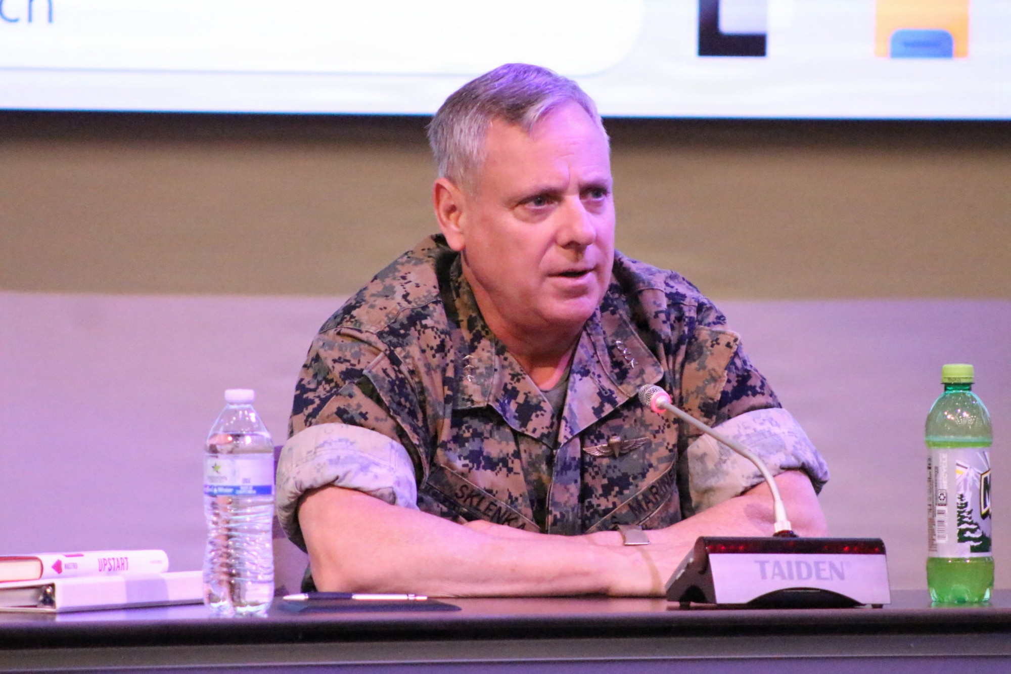 Service member sits on panel