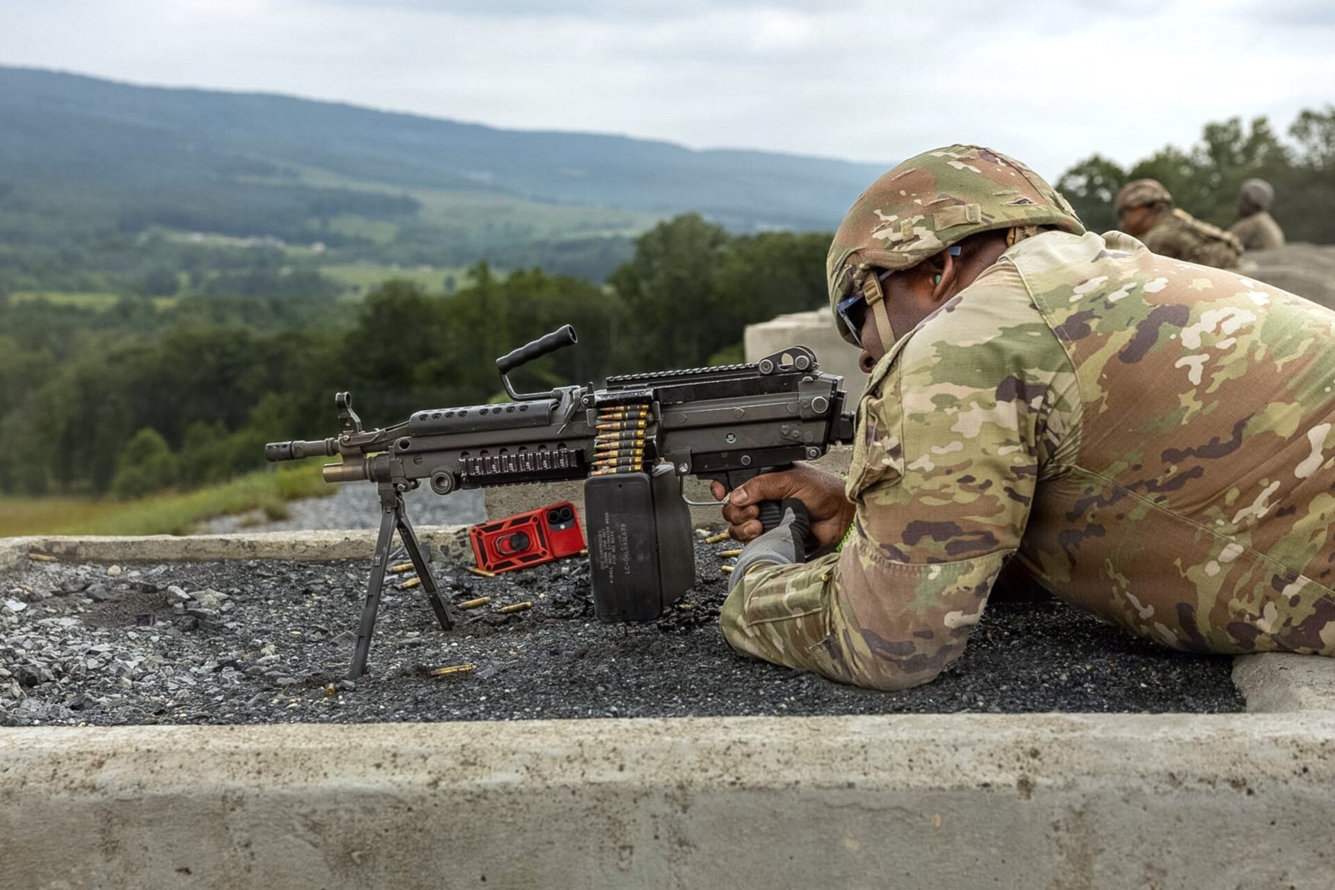 A Soldier assigned to the Delaware National Guard's 1049th Transportation Company fires an M249 Squad Automatic Weapon July 10, 2026, at Fort Indiantown Gap, Pennsylvania. This range now includes a quadcopter and fixed-wing live-fire concept that allows users to engage drones with M249 or M240B machine guns. (U.S. Army Photo by Pfc. Austin Duplessie)