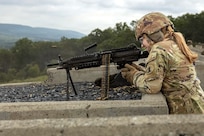 A Soldier assigned to the Delaware National Guard's 1049th Transportation Company fires an M249 Squad Automatic Weapon July 10, 2026, at Fort Indiantown Gap, Pennsylvania. This range now includes a quadcopter and fixed-wing live-fire concept that allows users to engage drones with M249 or M240B machine guns. (U.S. Army Photo by Pfc. Austin Duplessie)