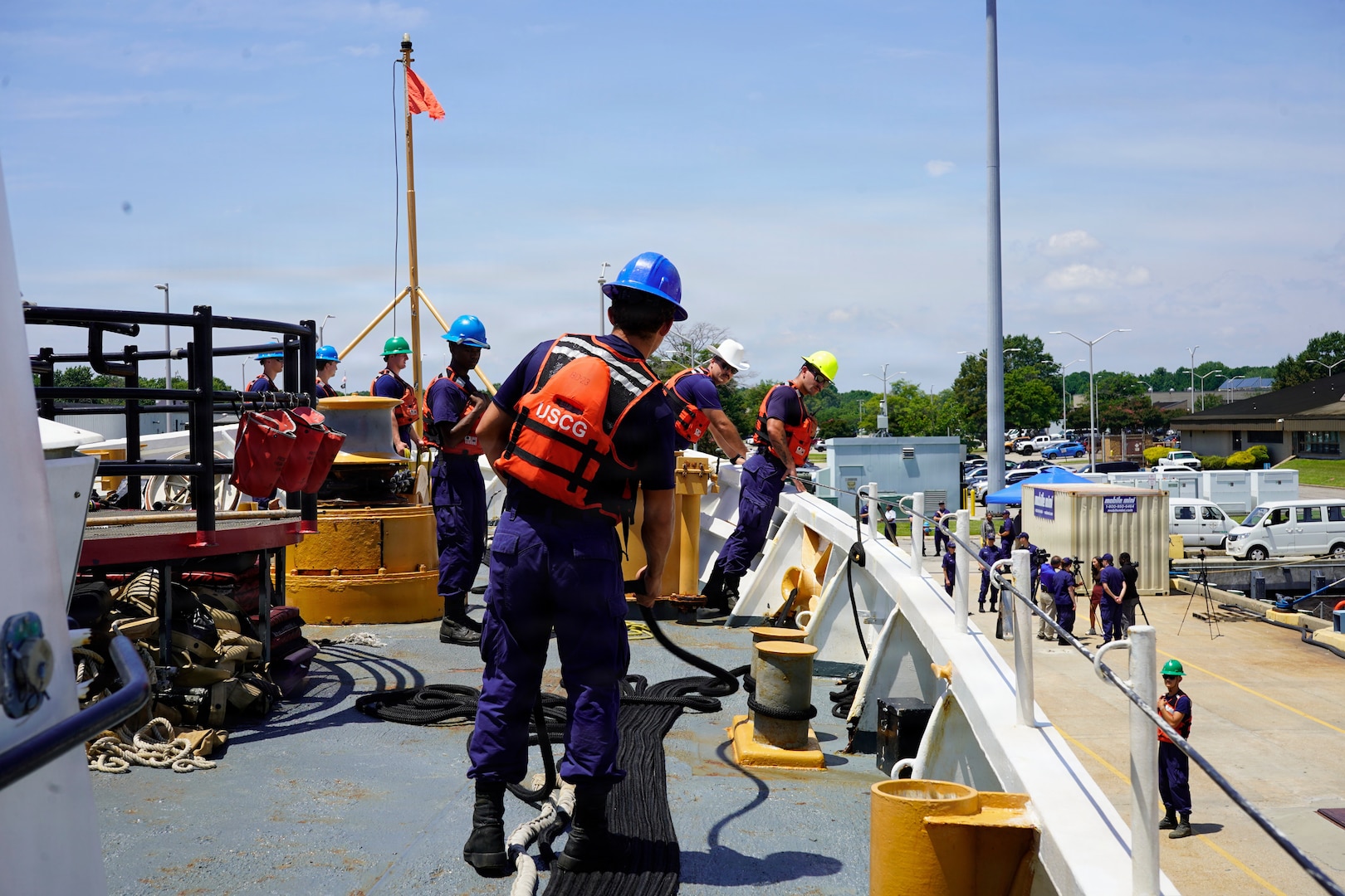 Deck department members assigned to the Reliance-class medium-endurance cutter USCGC Venturous (WMEC 625) man lines as the cutter moors at Coast Guard Base Portsmouth, July 10, 2026. The Venturous is one of two 210-foot medium endurance cutters relocating from St. Petersburg, Florida, to Base Portsmouth as part of a strategic home port shift bringing approximately 154 personnel and their families to the Hampton Roads area. (U.S. Coast Guard photo by Seaman Adriel Franqui-Toro)