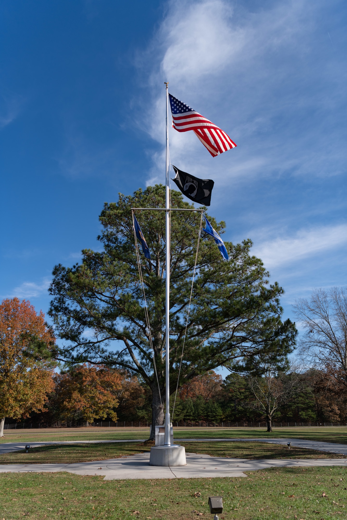 The American flag flies atop the pole in front of the Administration and Engineering Building at Arnold Air Force Base, Tenn., headquarters of Arnold Engineering Development Complex. The AEDC Safety team is encouraging team members to familiarize themselves with proper procedures when the music is played across the installation daily at 7:30 a.m. and 4:30 p.m. (U.S. Air Force photo by Keith Thornburgh)