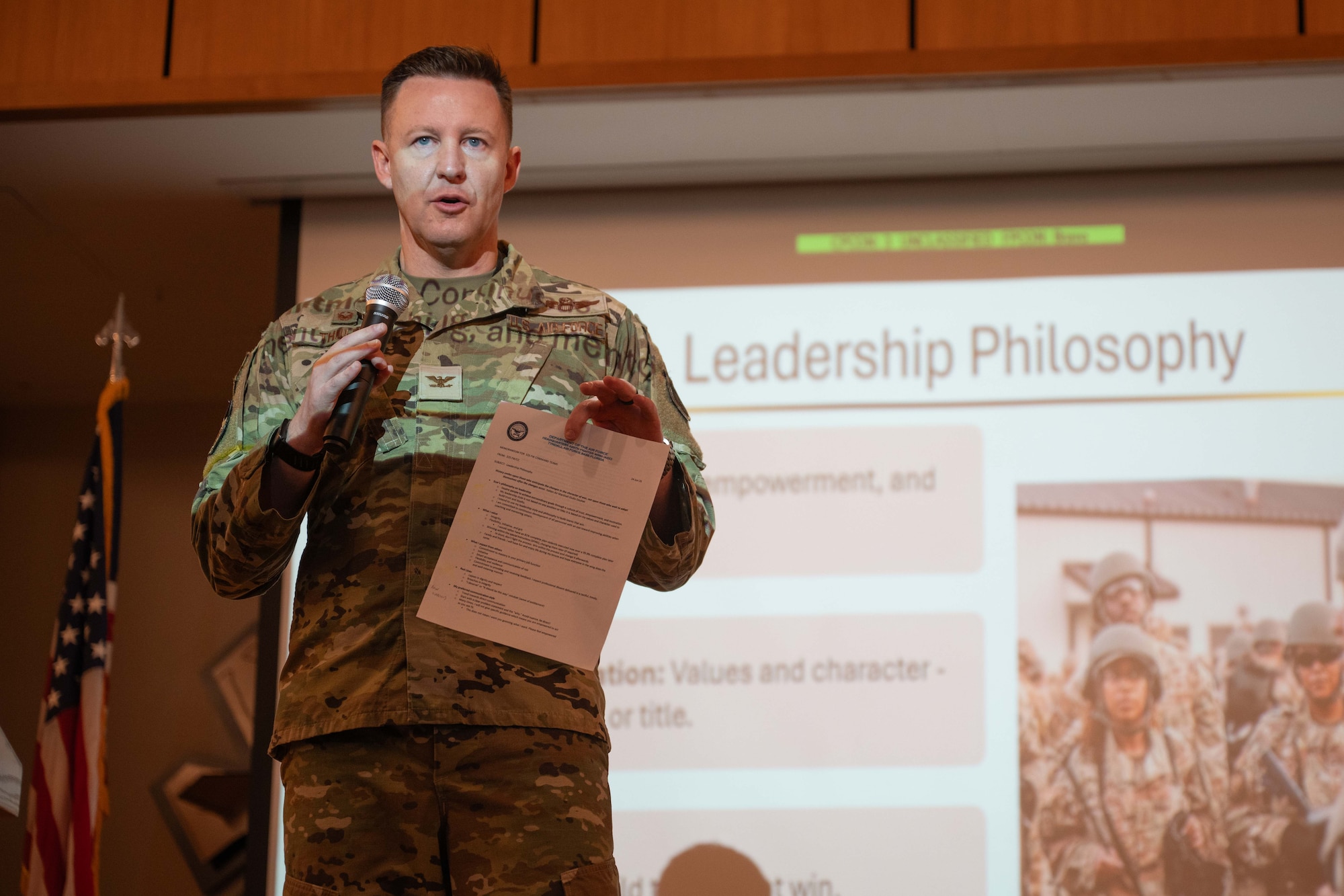 U.S. Air Force Col. Ryan Thulin, 325th Fighter Wing commander, speaks to Airmen during an all-call at Tyndall Air Force Base, Florida, July 14, 2026. The all-call served as the first wing-wide event for the new command team, aiming to outline their leadership philosophies and expectations for the 325th FW. (U.S. Air Force photo by Airman 1st Class Courtney McCants)