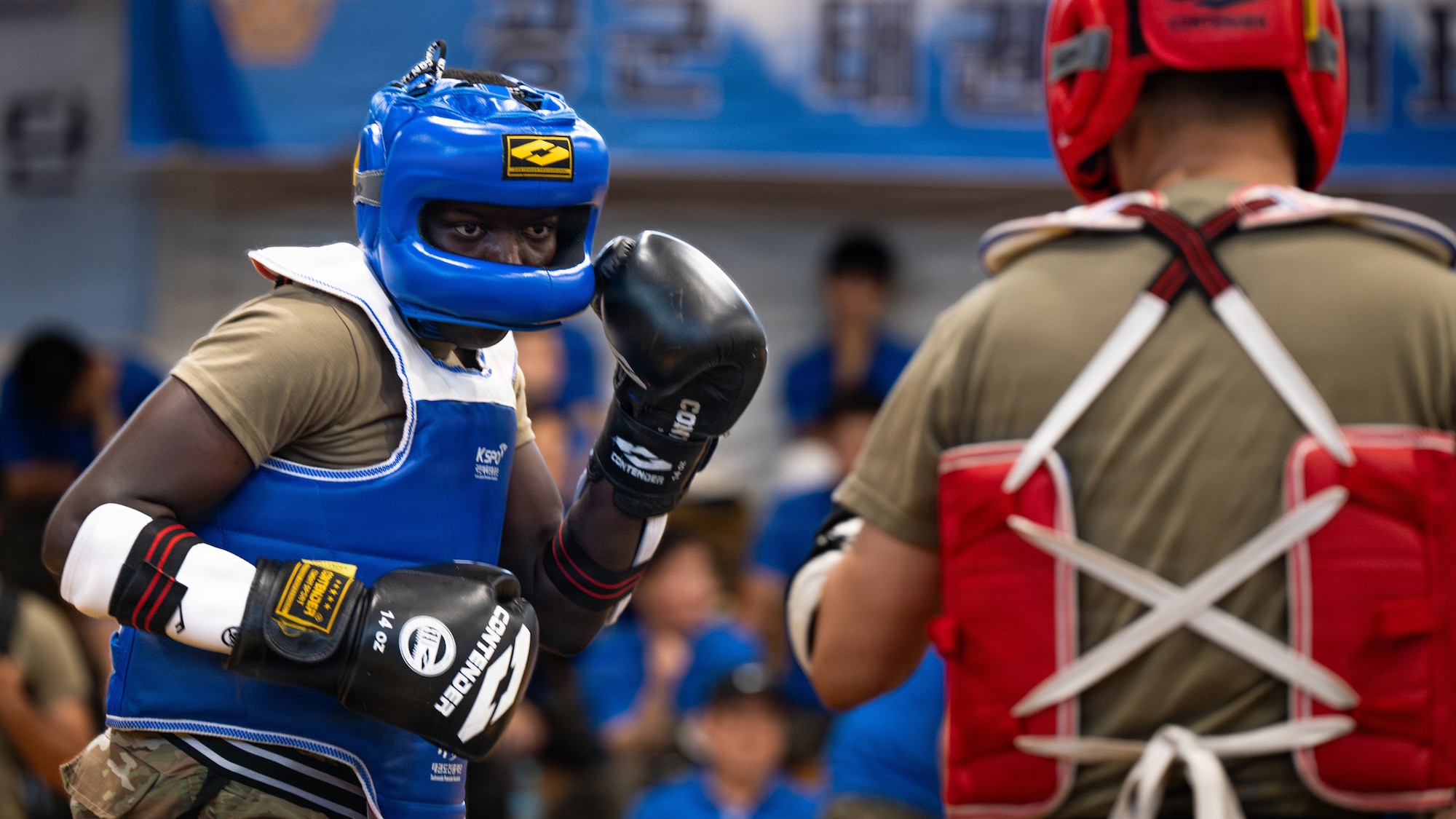 Two men spar.