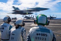 Sailors from the Philippines Navy observe flight operations on the flight deck of the Nimitz-class aircraft carrier USS Theodore Roosevelt (CVN 71) during Exercise Rim of the Pacific (RIMPAC), July 9, 2026.