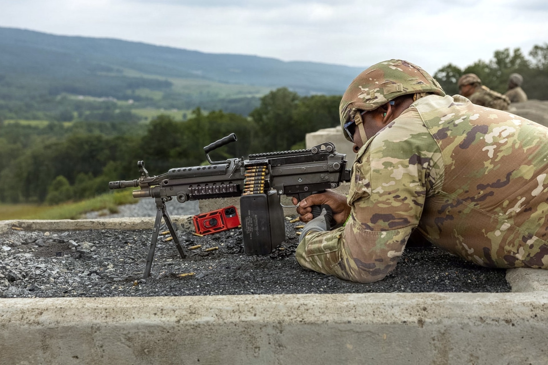A Soldier assigned to the Delaware National Guard's 1049th Transportation Company fires an M249 Squad Automatic Weapon July 10, 2026, at Fort Indiantown Gap, Pennsylvania. This range now includes a quadcopter and fixed-wing live-fire concept that allows users to engage drones with M249 or M240B machine guns. (U.S. Army Photo by Pfc. Austin Duplessie)