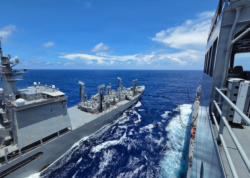 Japan Maritime Self-Defense Force Mashū-class replenishment ship JS Mashū (AOE 425) connects to Military Sealift Command’s John Lewis-class underway replenishment oiler USNS Earl Warren (T-AO 207) during a consolidated cargo replenishment (CONSOL) in the Philippine Sea, June 27, 2026.
