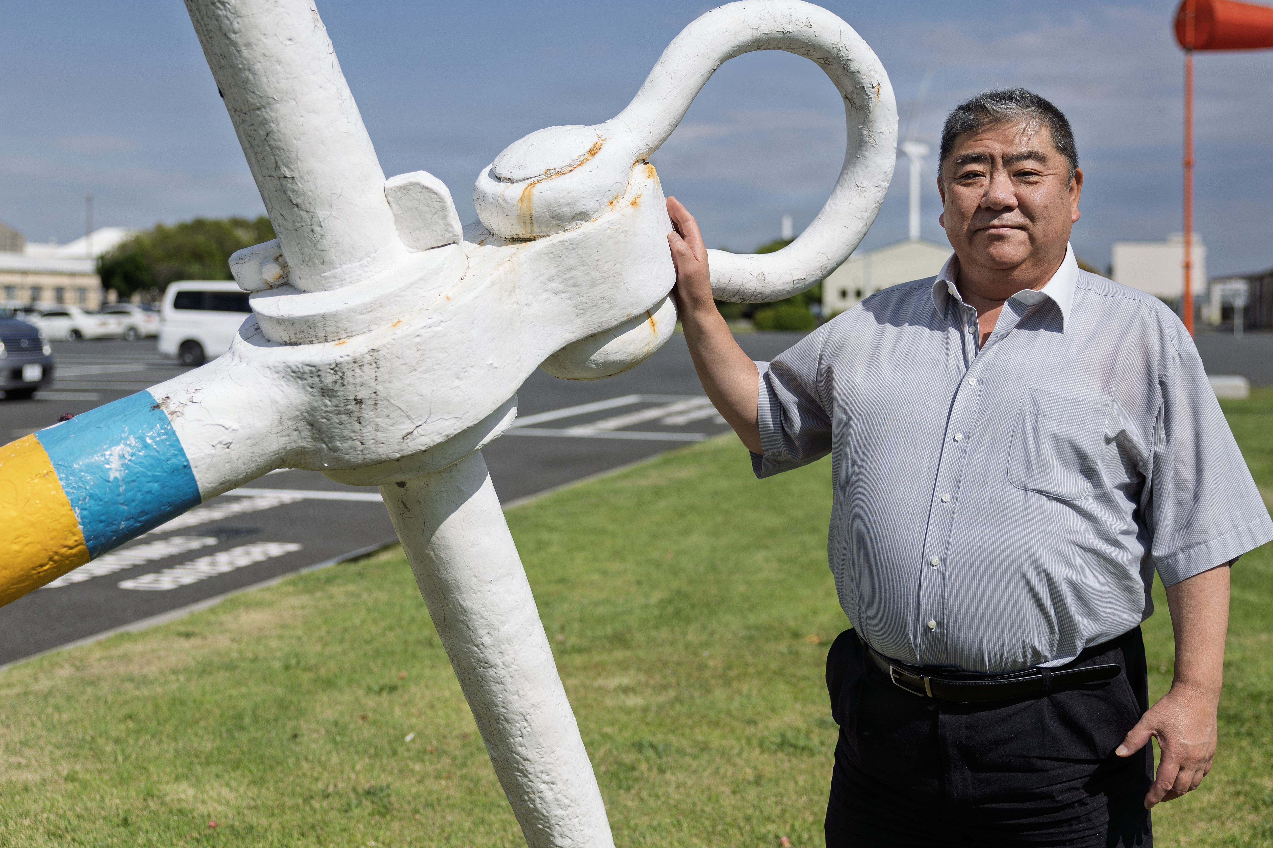 Japanese local national Endo Munenori, a tanker operations officer with Military Sealift Command Ship Support Unit Japan, poses for a photo at Yokohama North Dock, Japan, May 29, 2026. Munenori began working for MSC on June 2, 1985. (Photo by Grady T. Fontana)