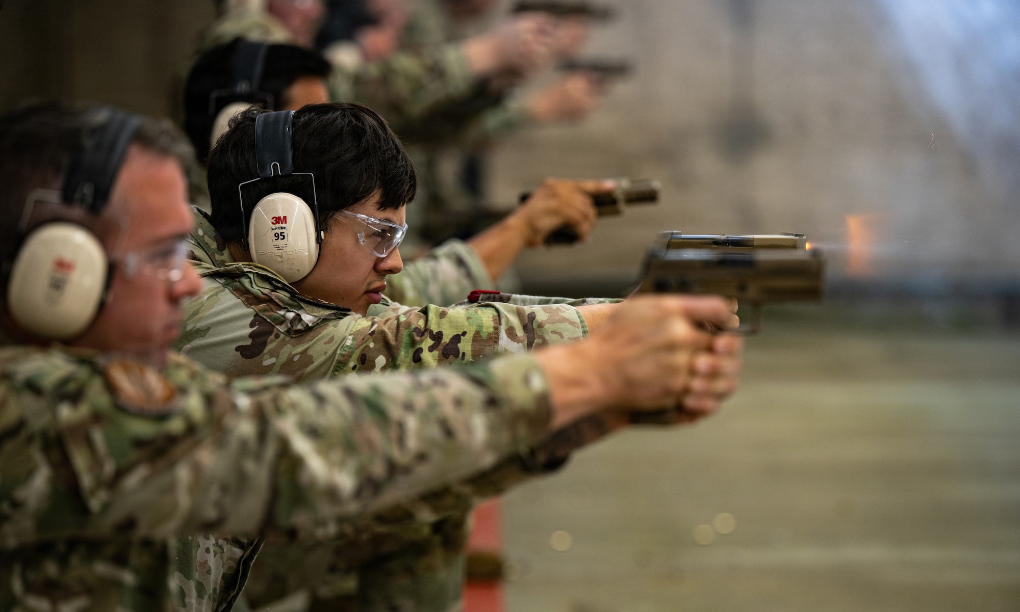 U.S. Air Force Airman 1st Class Luis Vega, assigned to the 100th Operations Support Squadron, fires a Sig Sauer M18 modular handgun during a qualification course at the Combat Arms Training and Maintenance range at RAF Feltwell, England, July 9, 2026.