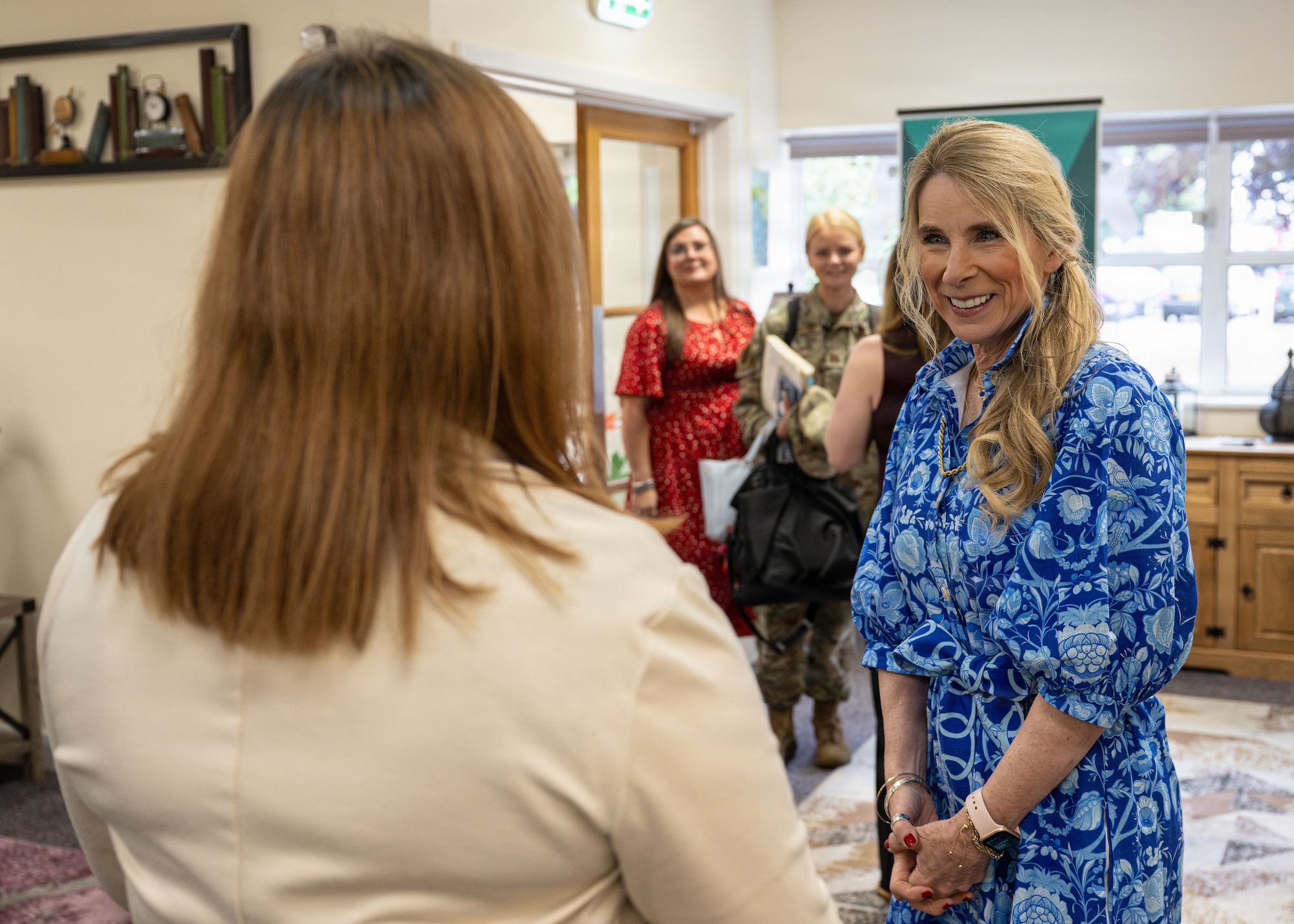 Mrs. Cindy Wilsbach, wife of Chief of Staff of the Air Force Gen. Ken Wilsbach, meets Charity Rose, 100th Air Refueling Wing integrated prevention chief, during a senior leader spouse engagement at RAF Mildenhall, England, July 13, 2026.