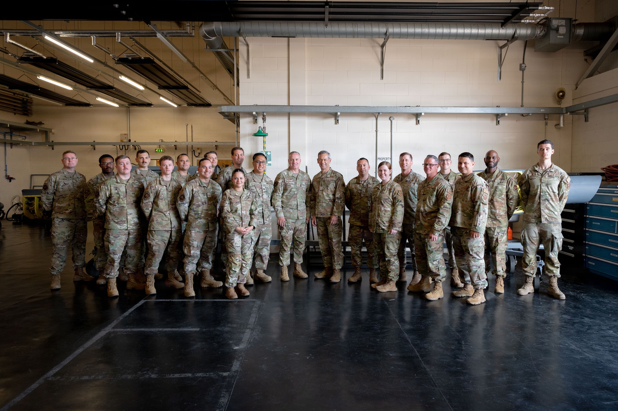 Air Force Chief of Staff Gen. Ken Wilsbach and Air Force Chief Master Sergeant of the Air Force David Wolfe pause for a photo with 100th Maintenance Squadron Airmen at RAF Mildenhall, England, July 13, 2026.