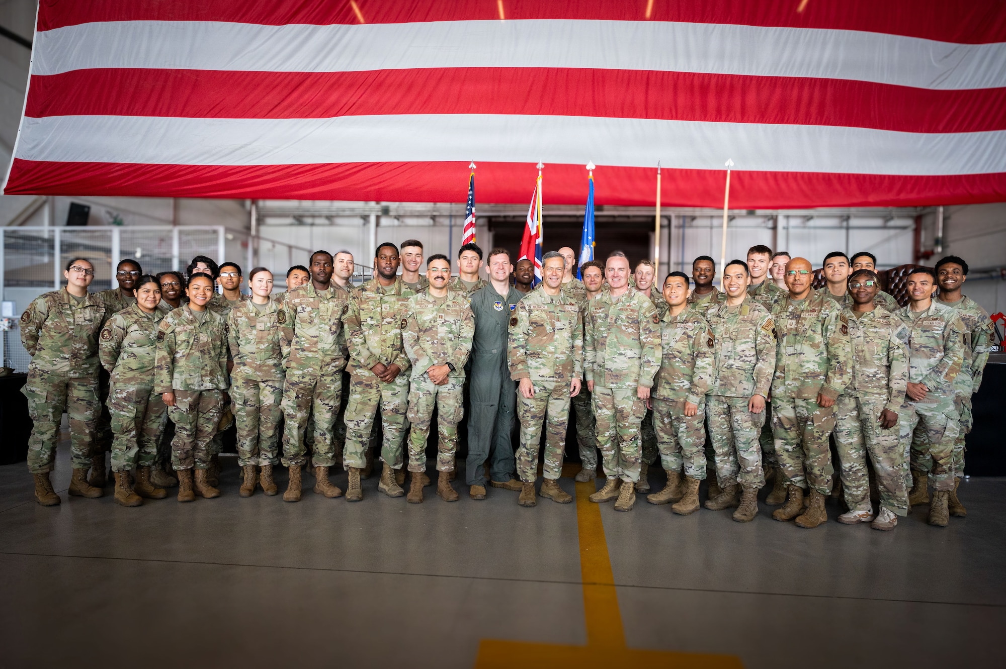 Air Force Chief of Staff Gen. Ken Wilsbach and Air Force Chief Master Sergeant of the Air Force David Wolfe pause for a photo with Team Mildenhall Airmen at RAF Mildenhall, England, July 13, 2026.