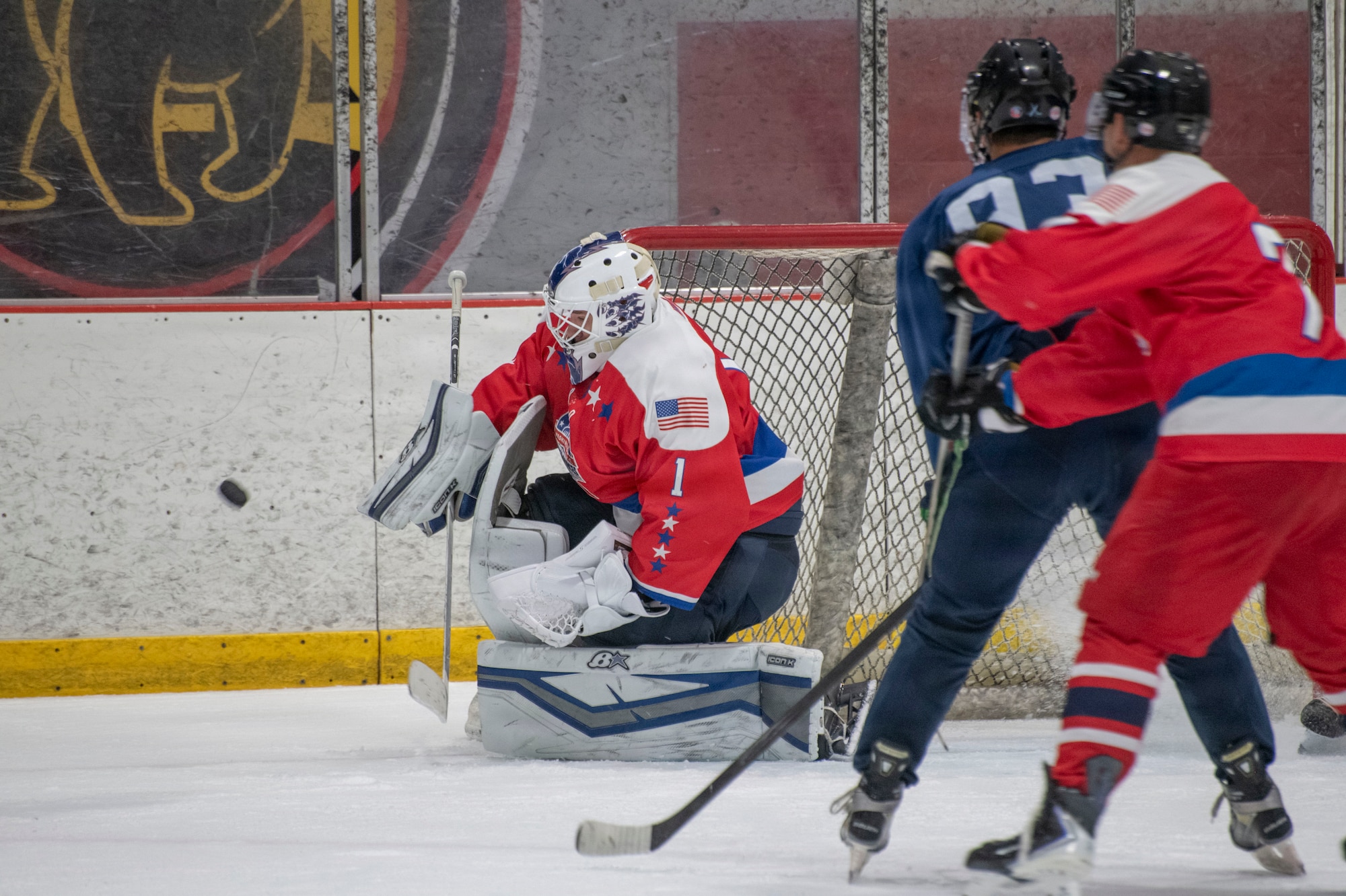 U.S. Air Force 1st Lt. Stanislav V. Barilov, 316th Security Forces Group executive officer, reaches to make a save for the D.C. Armed Forces Hockey Club during a game at Piney Orchard Ice Arena in Odenton, Maryland, June 27, 2026