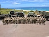 Kentucky National Guardsmen with the 1st Battalion, 623rd Field Artillery Regiment gather with members of the Japanese Ground Self Defense Force after the final rounds were fired of a combined live-fire exercise during Exercise Rim of the Pacific 2026 in Pacific Missile Range Facility Barking Sands in Kauai, Hawaii, July 12, 2026.Thirty nations, over 30 ships, five submarines, 15 national land forces, more than 190 aircraft and more than 30,000 personnel are participating in RIMPAC in and around the Hawaiian Islands, June 24 to July 31. The world's largest international maritime exercise, RIMPAC provides a unique training opportunity while fostering and sustaining cooperative relationships among participants critical to ensuring the safety of sea lanes and security on the world's oceans. RIMPAC 2026 is the 30th exercise in the series that began in 1971. (U.S. Army National Guard photo by 1st Sgt. Scott Raymond)