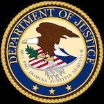 Department of Justice seal with an eagle standing on top of a shield with red and white stripes, 3 gold stars.