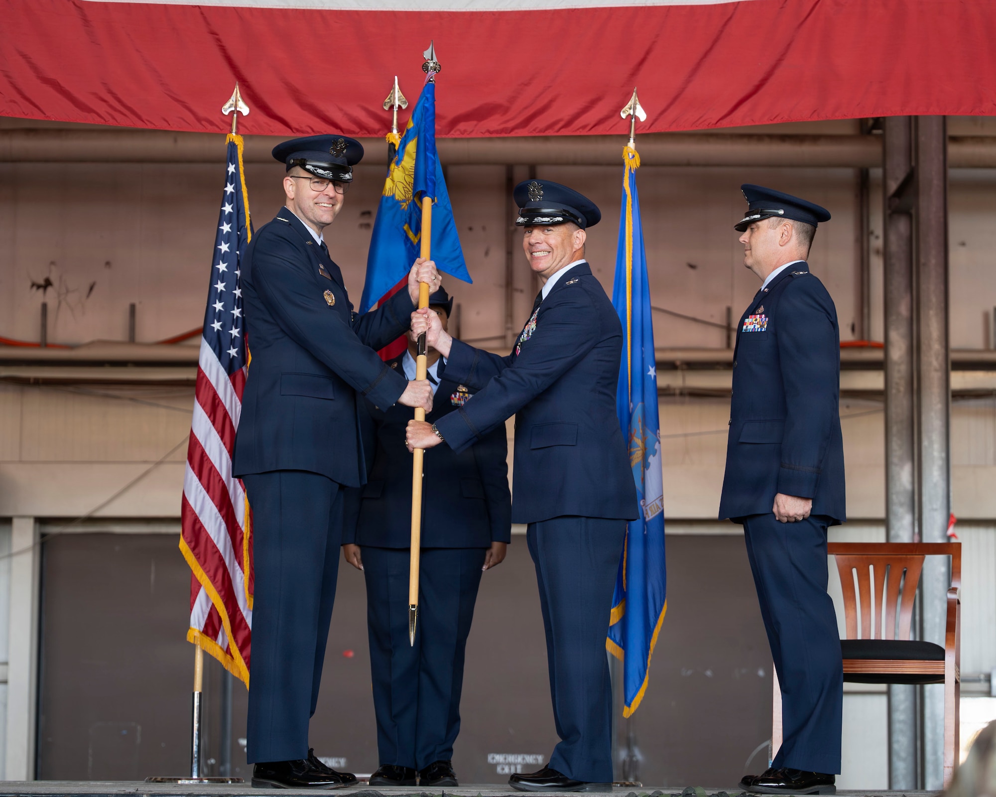 Men pose for a photo during a ceremony