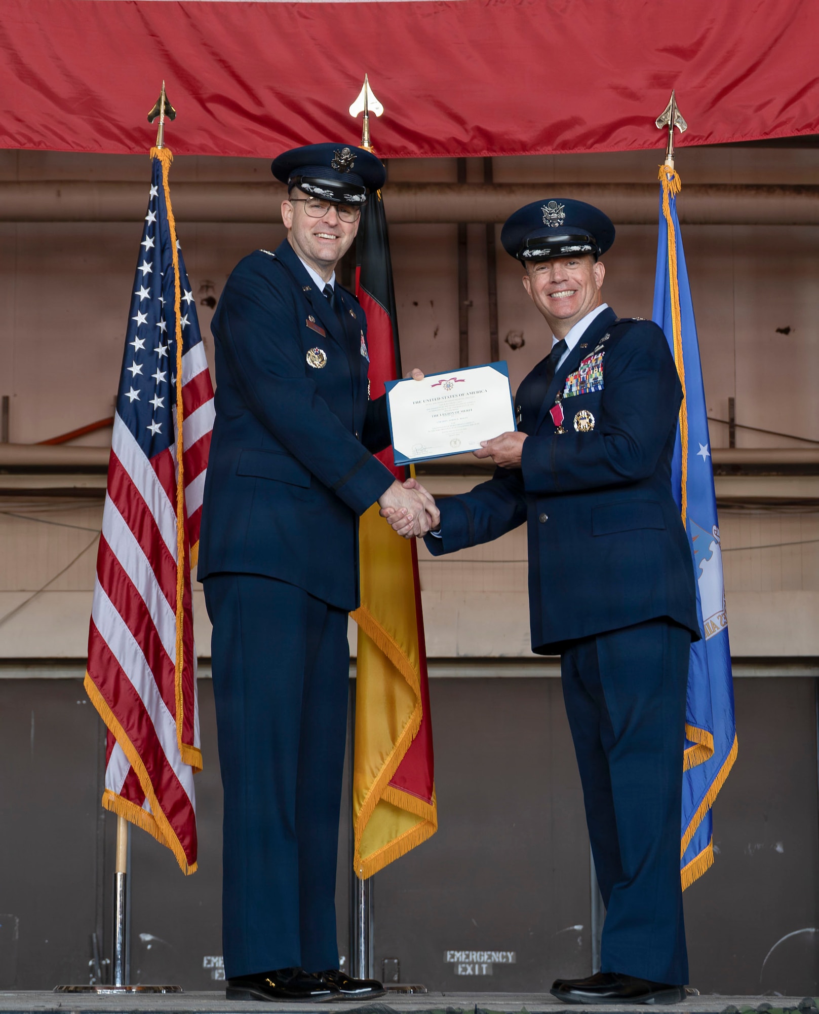 men pose for a photo during a ceremony