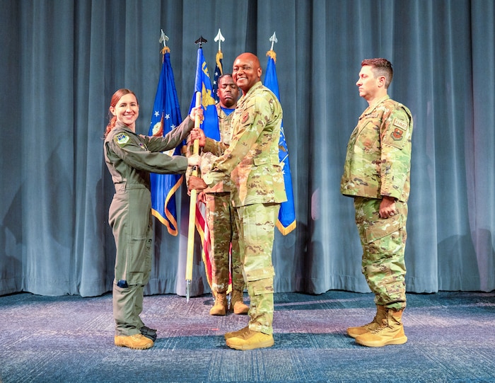 U.S. Air Force Col. Damian Holtzclaw, Air Force Global College commander, renders his final salute to Lt. Col. Burge, AFGC chief of staff, and members of AFGC during a change of command ceremony at Maxwell Air Force Base, Ala., July 10, 2026.