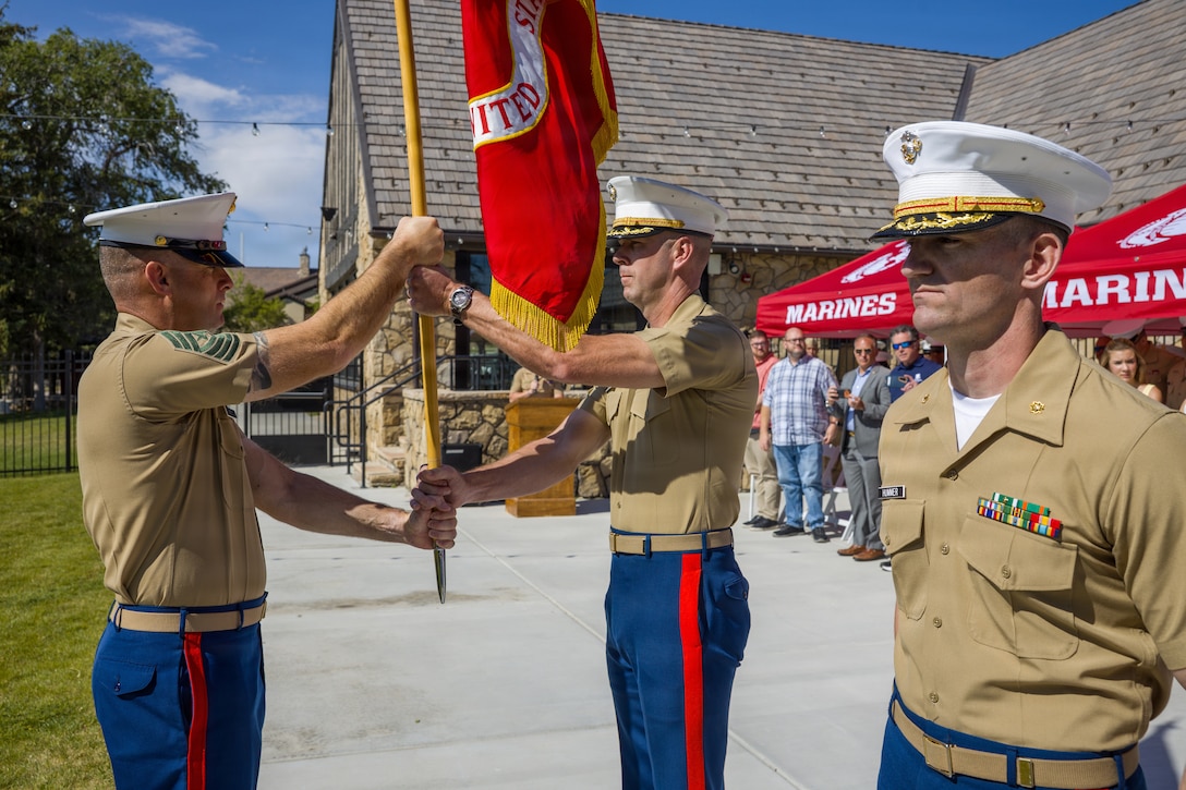 U.S. Marines with Recruiting Station Salt Lake City, 9th Marine Corps District, participate in a change of command ceremony at Camp Williams, Salt Lake City, Utah, June 19, 2026. The ceremony signifies the transfer of authority, accountability and leadership from the off-going commanding officer to the oncoming commanding officer. (U.S. Marine Corps photo by Cpl. Joseph E. DeMarcus)