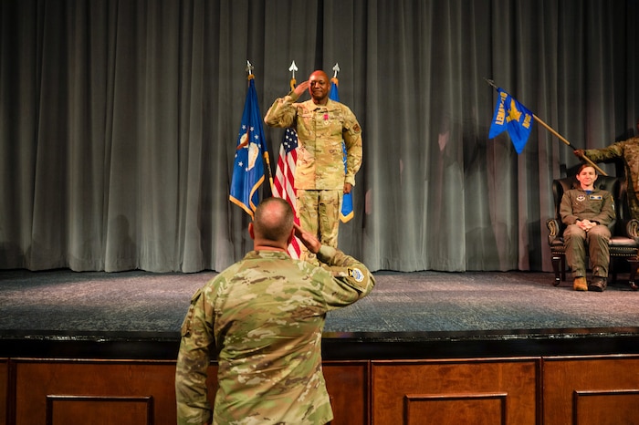 U.S. Air Force Col. Damian Holtzclaw, Air Force Global College commander, renders his final salute to Lt. Col. Burge, AFGC chief of staff, and members of AFGC during a change of command ceremony at Maxwell Air Force Base, Ala., July 10, 2026