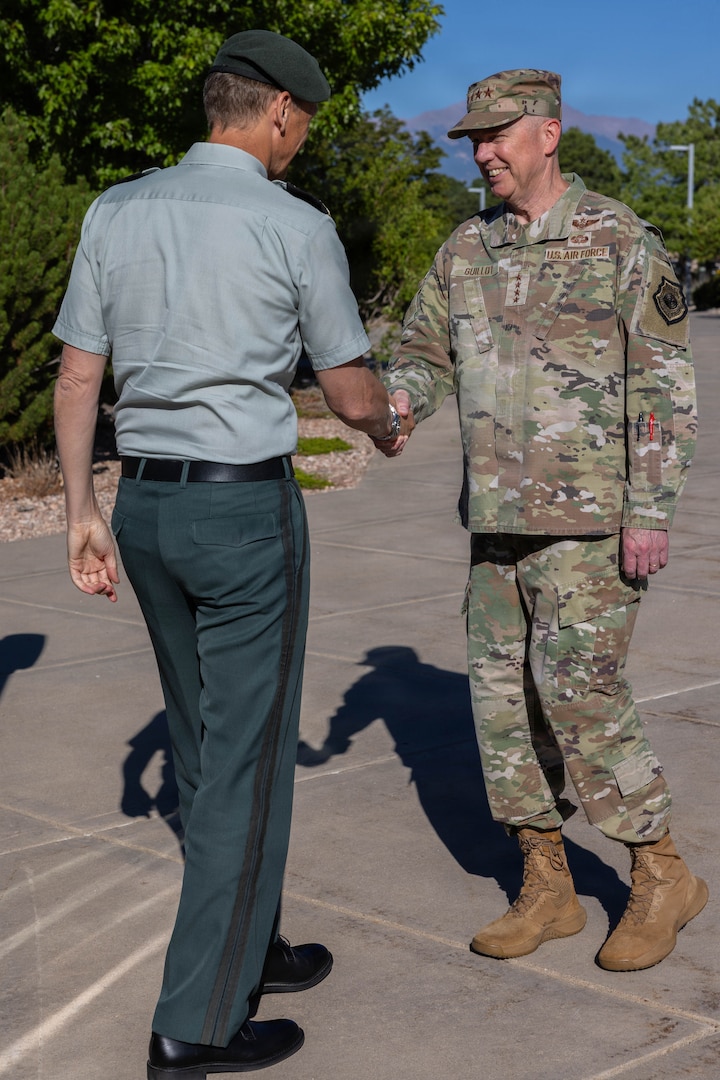 General Gregory Guillot, commander, North American Aerospace Defense Command and U.S. Northern Command, greets General Eirik Kristoffersen, Norwegian Chief of Defence, in front of the command’s headquarters building in Colorado Springs, Colorado, July 14, 2026. General Kristoffersen visited NORAD and USNORTHCOM to discuss opportunities for arctic and High North collaboration. (U.S. Department of War photo by MSgt Tabitha M. Lee)