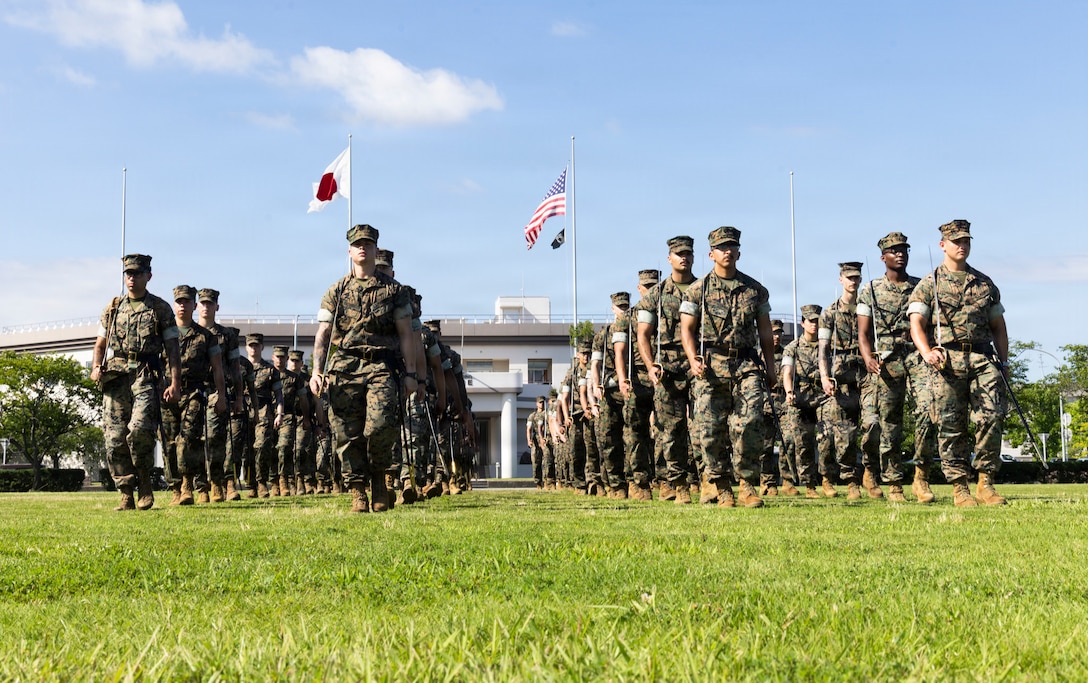 U.S. Marines attending the Marine Corps Air Station Iwakuni Sergeants Course practice drill and ceremony at MCAS Iwakuni, Yamaguchi, Japan, July 9, 2026. The inaugural resident sergeants course expanded professional military education opportunities for Marines stationed in Japan. (U.S. Marine Corps photo by Staff Sgt. Julian Elliott-Drouin)
