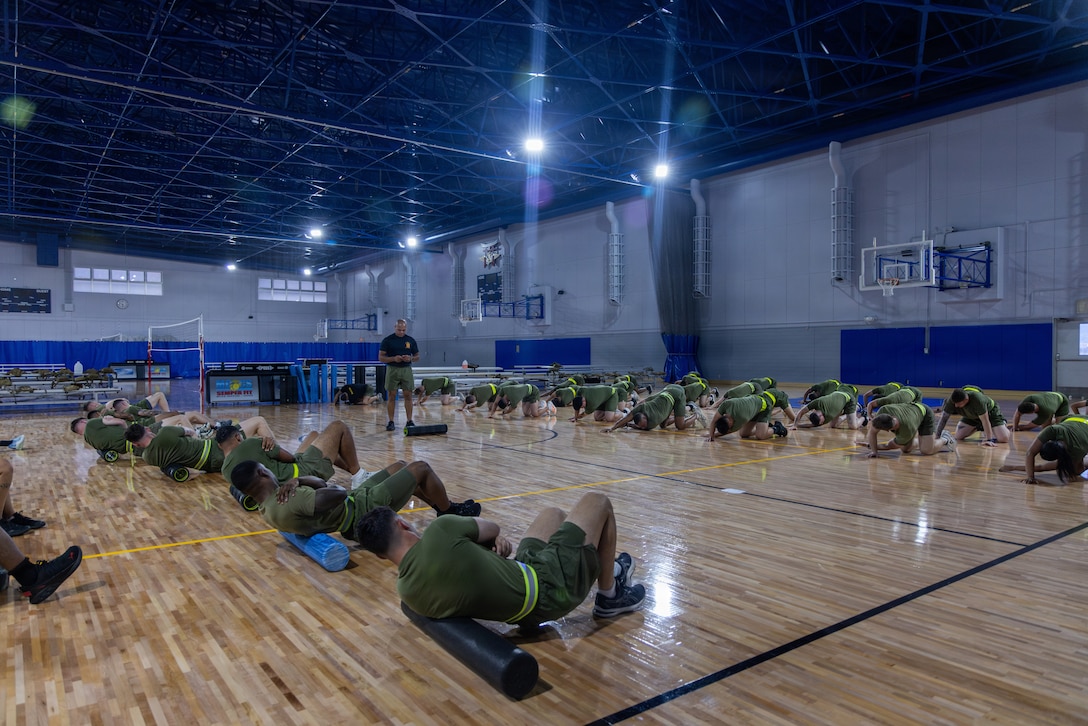 U.S. Marines attending the Marine Corps Air Station Iwakuni Sergeants Course perform stretches at MCAS Iwakuni, July 15, 2026. The inaugural resident sergeants course expanded professional military education opportunities for Marines stationed in Japan. (U.S. Marine Corps photo by Cpl. Alejandra Vega)