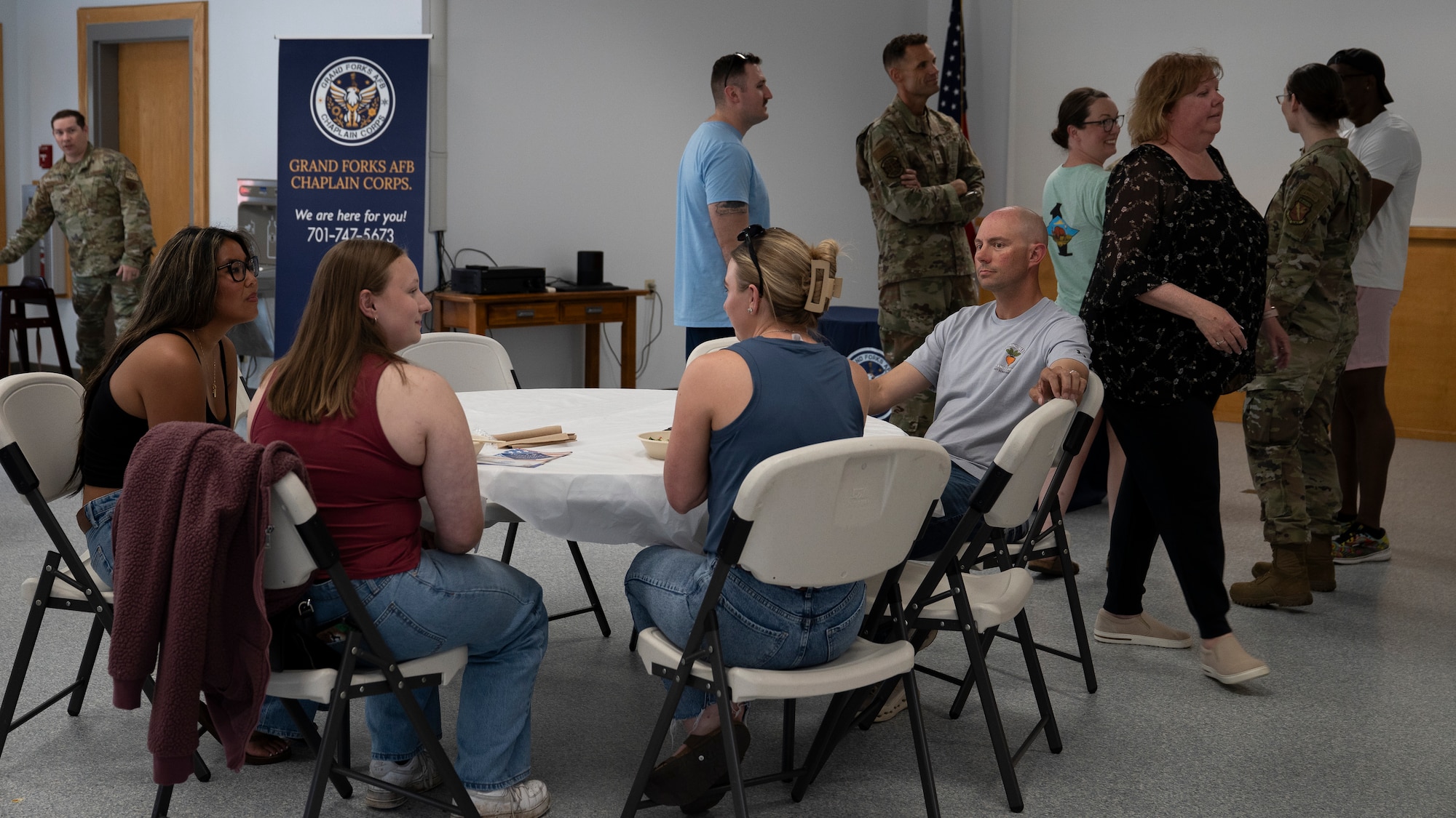 Families talk at a deployed family dinner.