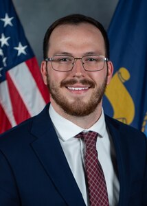 Kyle Risher poses for an official portrait at Naval Surface Warfare Center, Carderock Division in West Bethesda, Md. Risher serves as an operations research analyst in Carderock's Military Effectiveness Group and is a member of the joint Energy Supportability Analysis team recognized with the 2026 Warfare Center Innovation Award.