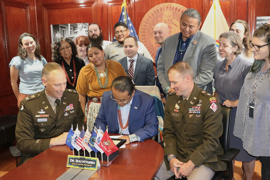 Navajo Nation President Buu Nygren, center, and U.S. Army Corps of Engineers Los Angeles District Commander Col. Andrew Baker, center left, sign an agreement for a $3 million feasibility study for the Birdsprings Flood-Risk Mitigation project June 1 in Window Rock, Arizona