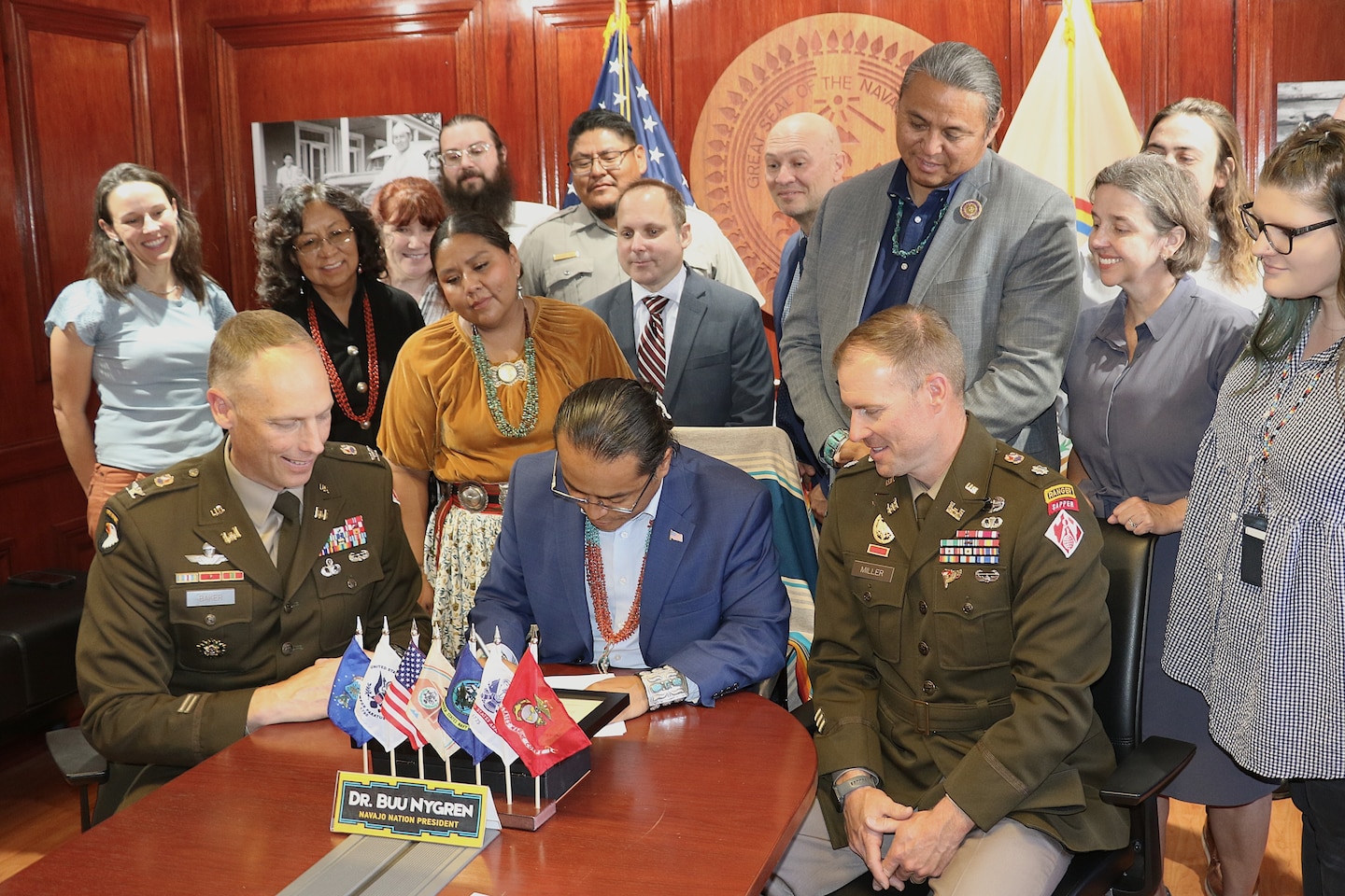 Navajo Nation President Buu Nygren, center, and U.S. Army Corps of Engineers Los Angeles District Commander Col. Andrew Baker, center left, sign an agreement for a $3 million feasibility study for the Birdsprings Flood-Risk Mitigation project June 1 in Window Rock, Arizona